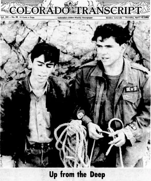 Two teenaged boys holding climbing ropes