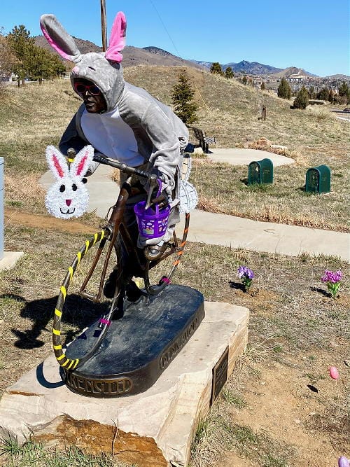 Bronze statue of a bike racer dressed in an Easter Bunny suit - Golden, Colorado - photo by Bud Rockhill