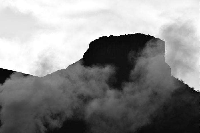 Clouds drifting around Castle Rock in Golden Colorado