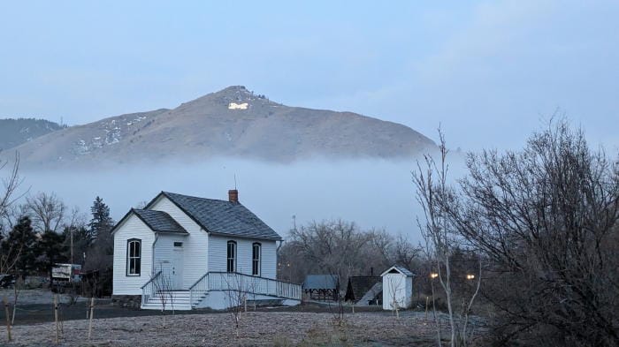 Low-lying clouds obscure the base of Mount Zion, as seen from the Golden History Park.