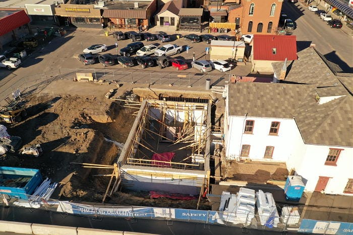 Aerial photo shows the excavation in the back yard of the Astor House. Foothills Art Center is building an addition prior to moving into the Astor House. Photo by Patrick Klein.