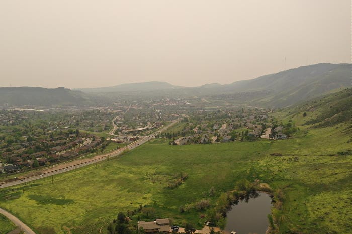 A view from the north end of the Golden valley.  The grass is very green and the air is smoggy due to smoke from Canadian wildfires.