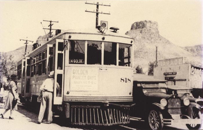 Route 84 electric car that ran between Golden and Denver. Castle Rock in the background.