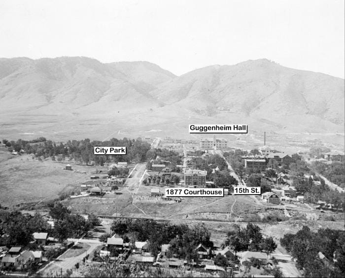 Photo estimated 1905-1905, shows Colorado School of Mines campus with Guggenheim, Chauvenet and Stratton Halls, the old 1878 Jefferson County Courthouse, and City Park