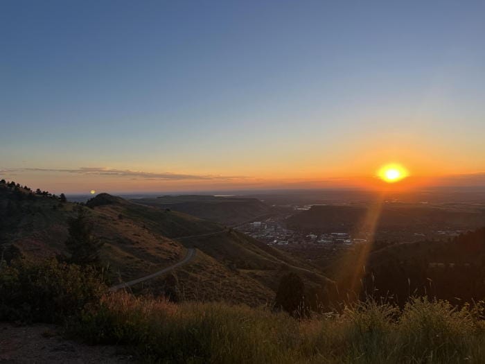 View from the Lariat Loop at sunrise.  The Golden valley lies below, still in the shadows of the Table Mountains.