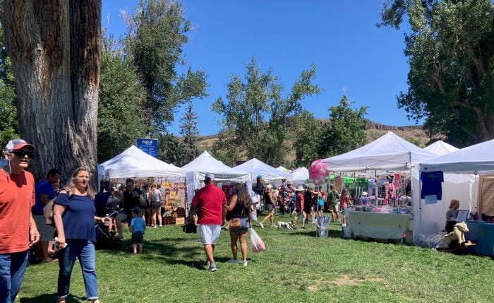 Tents in Parfet Park for the Buffalo Bill Craft Fair - North Table Mountain in the background