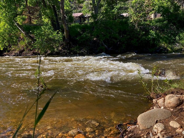 Rapid on Clear Creek in downtown Golden - water is brownish from high rainfall.