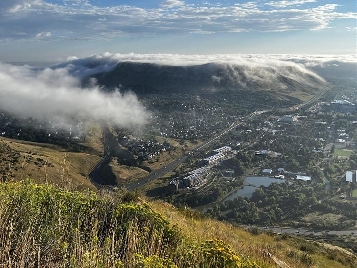 View of North Table Mountain with a thin layer of clouds.  View taken from Mt. Zion.  One fluffy cloud in the foreground.