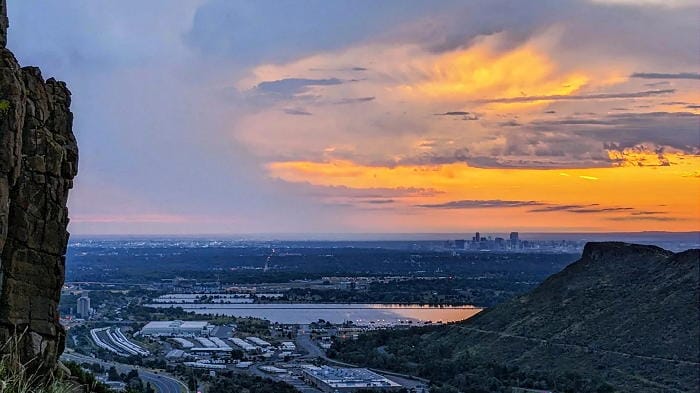 Sunrise view of Denver from North Table Mountain with pond in the foreground