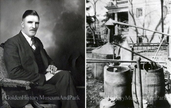 Sheriff James H. Biggins, Jr. and confiscated stills next to the county jail