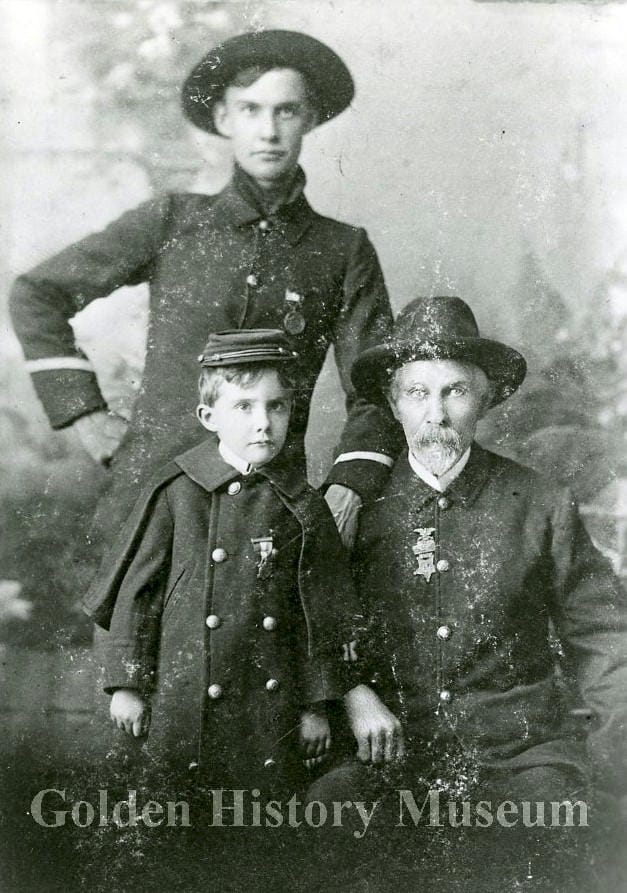 old man, young man, and little boy dressed in military attire