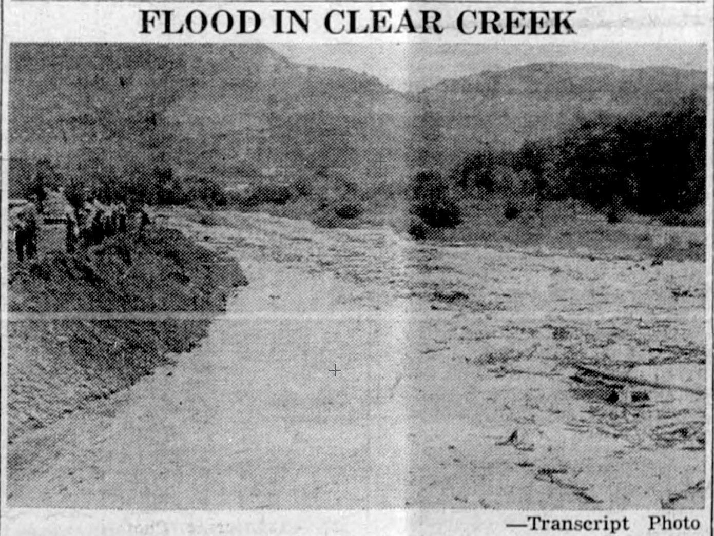 fuzzy newspaper image showing people on the south bank of Clear Creek, watching floodwater filled with debris