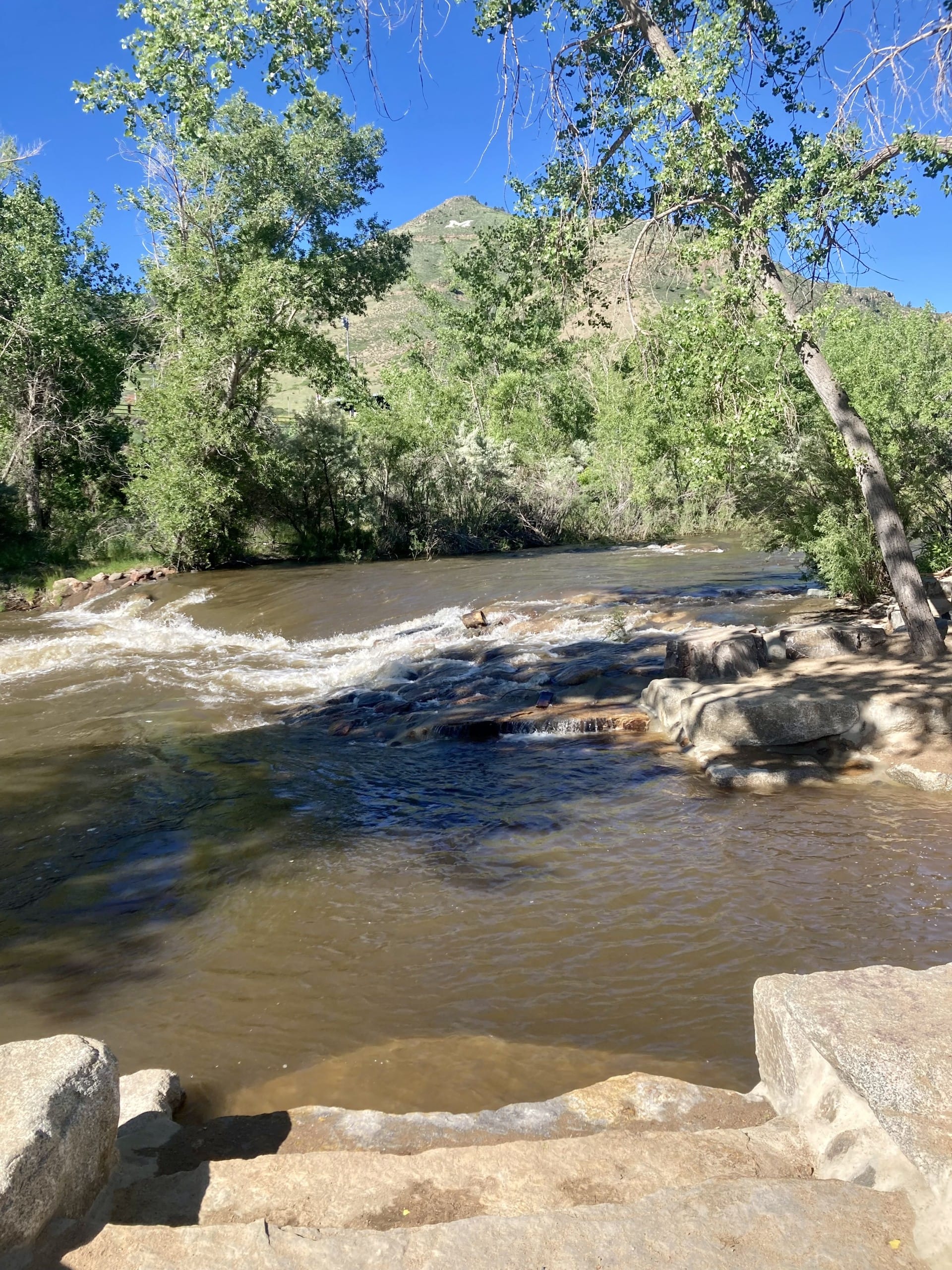 high water in Clear Creek, brown with turbidity