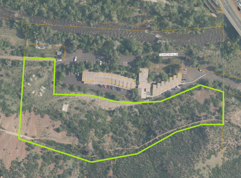 satellite view on the land south of Clear Creek with one long building complex (condos) and a larger area outlined south of it