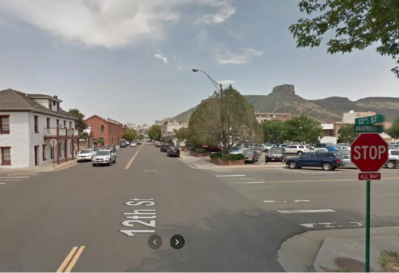 Google street image show the intersection at 12th & Arapahoe--Astor House on the left, Castle Rock in the background