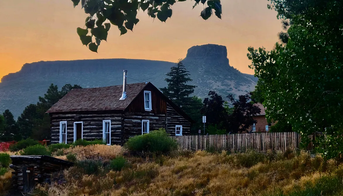 Golden History Park and Castle Rock beneath a glowing red sky