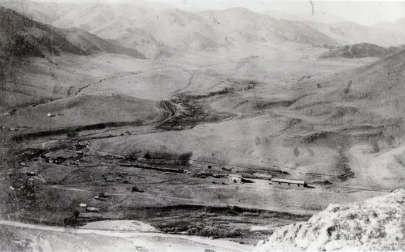 black & white photo taken from south table mountain, looking north along the foothills. Very few buildings