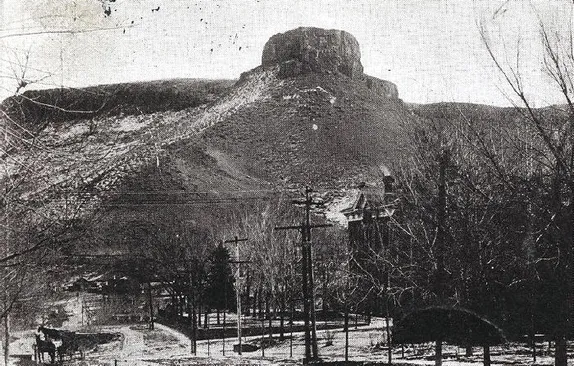 black and white winter image of 15th street.  Horse and wagon in the distance and 1878 courthouse