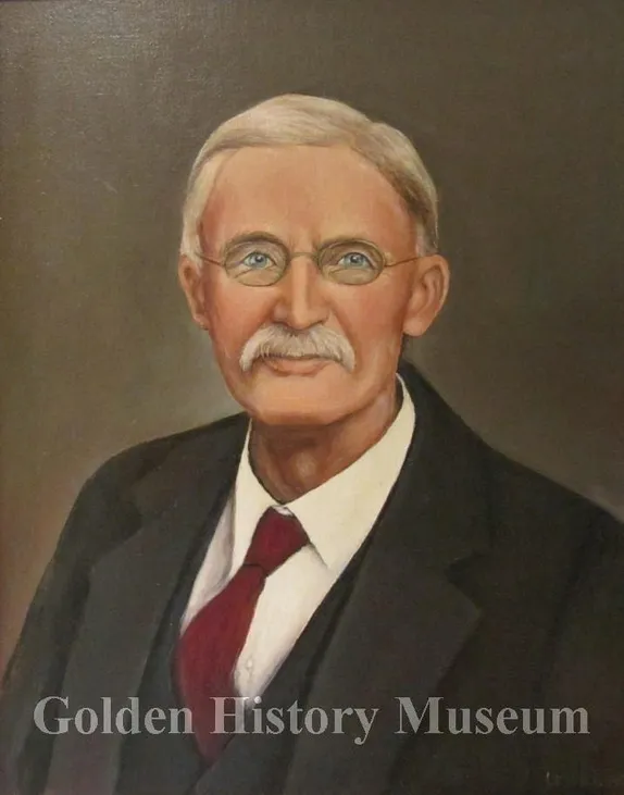 oil painting of a white-haired, mustached man in a suit wearing wire-rimmed glasses